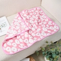 Pink coral fleece pet blanket with white spots on a sofa in a cozy home setting - Pink Lips
