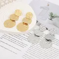 Detailed macro view of bohemian triple disc drop earrings with textured hammered finish - Gold EH010 (3-Layer Hammered)
