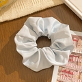 Detail of light blue polka dot scrunchie fabric texture on a dark wooden background - Blue Twill Texture Scrunchie