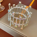 Detailed close-up of a silver crown accessory with sparkling AB rhinestones and crystal beads - Colorful