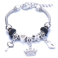 Silver snake chain charm bracelet with crown, heart pendants and black crystals - Black