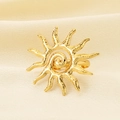Detailed macro view of the golden solar spiral stainless steel ring on beige textured fabric - Sun Spiral Style (KR113713-SP)