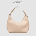 Detailed view of the stylish apricot litchi pattern leather underarm shoulder dumpling bag. - Apricot