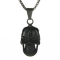 Vintage black skull pendant necklace in polished titanium steel on a white background - Cracked Skull + Plated Chain / Black
