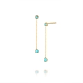 Detail view of gold tassel earrings with round turquoise stones on white background - 925 Silver / Gold - Synthetic Turquoise