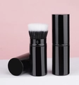 Retractable black makeup brush with dual-tone bristles and cylindrical storage case - Stippling Telescopic Brush / Black