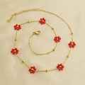 Detail of golden stainless steel necklace with red flower beads and lobster clasp - Red Necklace