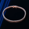 Minimalist 2mm moissanite tennis bracelet in rose gold finish on reflective surface - 14cm / Moissanite Style / Rose Gold