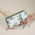 White butterfly print clutch bag with green starry patterns and golden hardware - Green