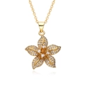 Macro detail of gold plated lotus flower pendant necklace with sparkling cubic zirconia - Five-petal Flower Style (G240)