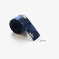 Dark blue 2.5cm Christmas satin ribbon with gold snowflakes and Merry Christmas text - 2.5 Blue Gold Foil Snowflake Letters (6 Yards)