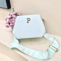 Light blue faux leather tote bag with wide green branded strap and gold P hardware - White with Green Strap