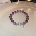 Macro shot of purple glass beads bracelet with zircon crescent moon and star charms - Silver-Purple