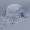 Close-up of light blue washed denim sun hat with adjustable strap and silver metal buckle - 56-58cm / Light Blue