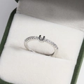 Macro shot of 18k gold plated adjustable U-shaped diamond ring in a luxury gift box - Platinum U