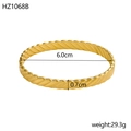 Detail view of 18K gold plated bangle with dimensions 6.0cm diameter and 0.7cm width - Inner Diameter 6.0cm Width 0.7cm / Gold (Twisted Rope)