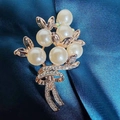 Elegant pearl bouquet brooch with gold leaves and rhinestone ribbon on blue silk - Bouquet Corsage