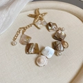 Collar de cuentas de estrella de mar con dijes de nácar y perlas en acabado oro - Pulsera - Dorado