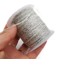 Close-up of grey and dark green twisted cotton rope on spool for DIY crafts - Approx. 2.0mm / Grey, White and Dark Green