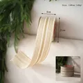 Close-up of gold striped ribbon with Merry Christmas design for elegant gift wrapping - Champagne Striped Linen Texture Ribbon 6.3cm*10 Yards