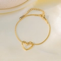 Bracelet coeur en titane doré élégant avec chaîne serpent et fermoir mousqueton réglable - Bracelet cœur torsadé / Or