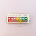 White social battery enamel pin with sliding gold bolt and rainbow status scale - Social Battery Slider / Smiley Face White
