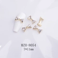 Detailed macro view of a 7x11mm gold metal bow nail charm with sparkling K9 crystals - Large Gold Bowknot (8054)