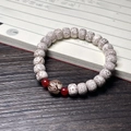 Star Moon Bodhi bead bracelet with red agate accents on a vintage calligraphy book - Star Moon Bracelet (Lotus Style)