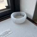 Wide marbled resin bangle with grey swirl pattern on white base in minimalist style - Textured White