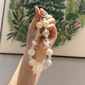 Beaded acrylic keychain featuring ivory pearls, ice-cracked beads, and a clear heart charm - Pearlescent Ivory White