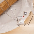 Collana cuore in acciaio titanio argento con intarsio in perla e dimensioni reali - Cuore Doppio Lato 2578