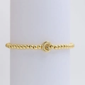 Chic gold-plated beaded elastic bracelet featuring a prominent capital letter G pendant - Gold G