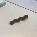 Glossy chocolate brown wave-shaped hair claw clip on a minimalist white table - Dark Brown Wave Style(FJ310)