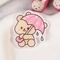 Cute acrylic bear pin featuring a brown bear holding a pink polka dot umbrella - Umbrella Bear