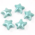Detailed view of five cyan blue ceramic starfish beads with white polka dot glaze finish - Turquoise (04#)