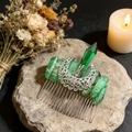 Close-up of handmade moon hair comb with green crystal pillars on a stone base - Green Crystal + Hollow Moon