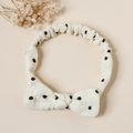 Detailed view of cream elastic cotton headband with black polka dots and a bow knot - Black Polka Dot