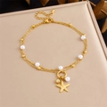 Detail of gold-plated starfish anklet with white pearls and sparkling zircon on satin - Zircon Starfish Pearl Double Layer Style (B1700)