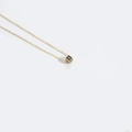 Minimalist golden necklace featuring a black cube pendant with the letter I - Letter I