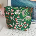 Portable dark green floral makeup bag with pink flowers on a white laptop - Dark Green Floral Small