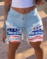 Detailed close-up of distressed denim shorts with American flag patch under the ripped denim - S / Starry Sky Patch