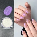 Nail Aurora powder in square jar showing purple iridescent effect on sheer base - Aurora Purple