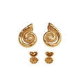 Macro detail of gold spiral snail earrings with pearls and heart-shaped ear backings - Gold Pearl Style