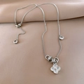 Macro detail of silver clover pendant with zircon inlay and adjustable sliding chain link - Silver Micro-Pave Clover Style (6#)