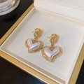 Vintage heart pearl earrings with ornate gold-tone settings in a jewelry box - 40 Silver Earring Post - Golden Heart
