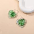 Detail of heart-shaped glass pendants with internal green flower and gold foil flakes - Green (Type C)