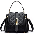Elegant black quilted bucket bag with gold hardware and a top handle for stylish women - Black