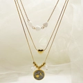 Three-layer gold necklace featuring heart beads, heart pendant, and star moon motif - Gray