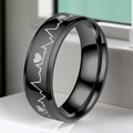 Close-up of black stainless steel ring featuring silver heartbeat and heart engravings - US 6 / Black