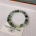 Detail view of transparent green phantom crystal beads and gold spacer on hemp fabric - Green Phantom Lucky Bead Style (8#)